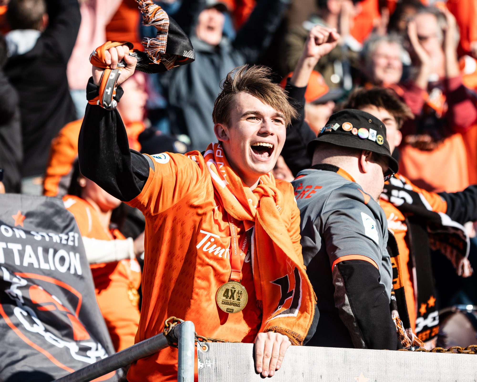 HAMILTON, ON – APR. 13, 2024: Forge FC fans celebrate a goal scored during the second half of Canadian Premier League action against Cavalry FC. HAMILTON, ON - APR. 13, 2024: Forge FC fans celebrate a goal scored during the second half of Canadian Premier League action against Cavalry FC.
